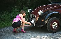 Motorsport models: girl with old antique retro classic car