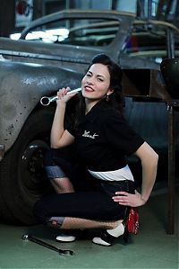 Motorsport models: girl with old antique retro classic car