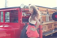 Motorsport models: girl with old antique retro classic car