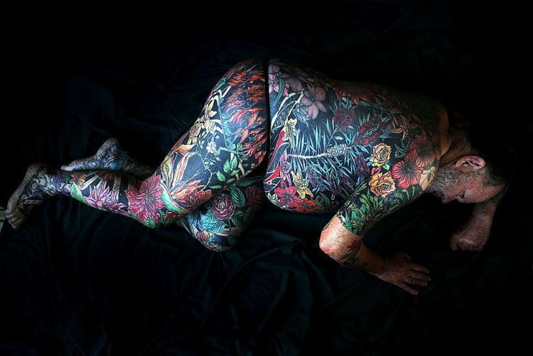 Retired teacher Geoff Ostling displays his tattooed skin