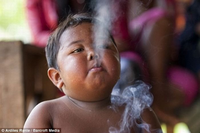 2-year-old boy smokes, Indonesia