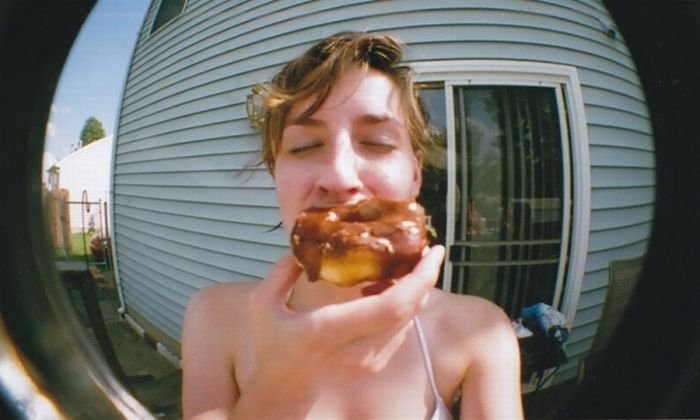 girl eating doughnut