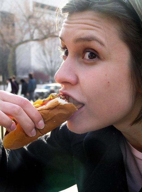 girl eating hot dog