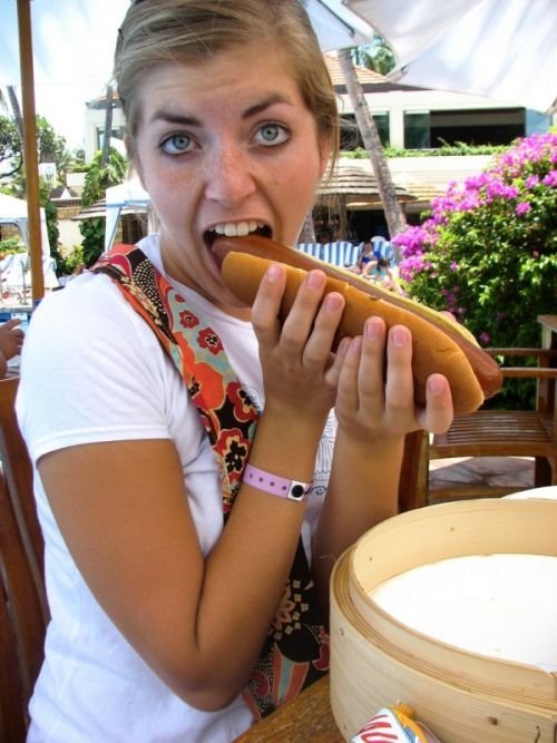 girl eating hot dog