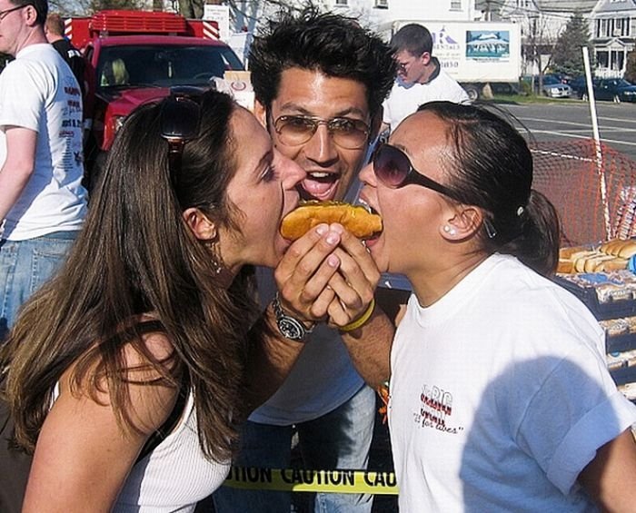 girl eating hot dog