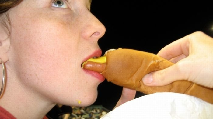 girl eating hot dog