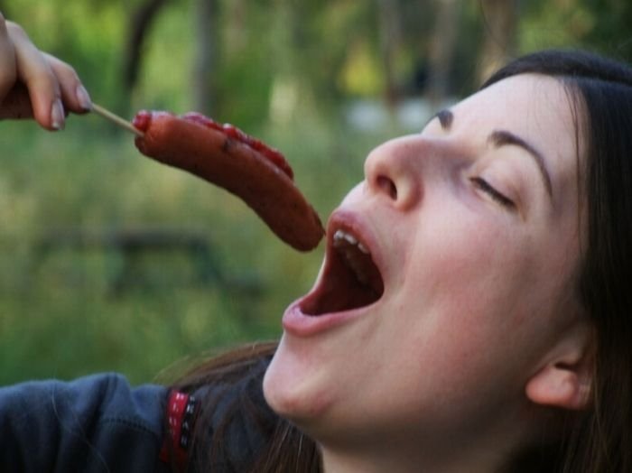 girl eating hot dog