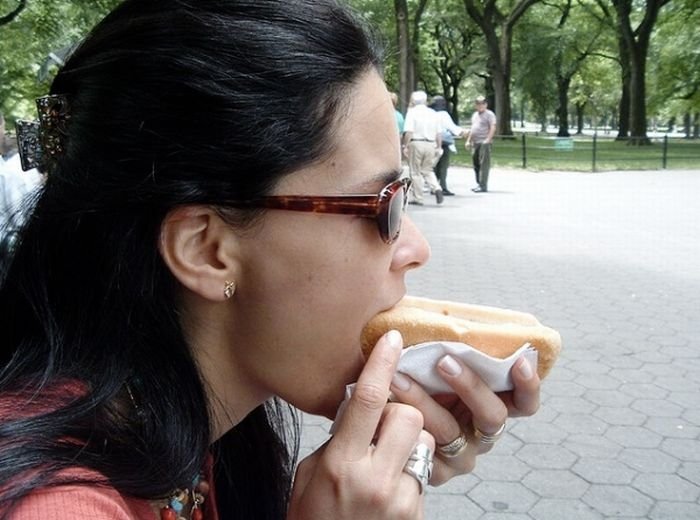 girl eating hot dog