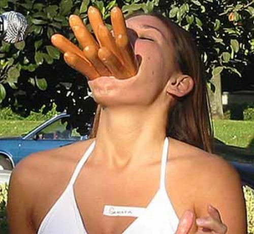 girl eating hot dog