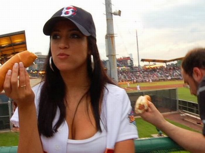 girl eating hot dog