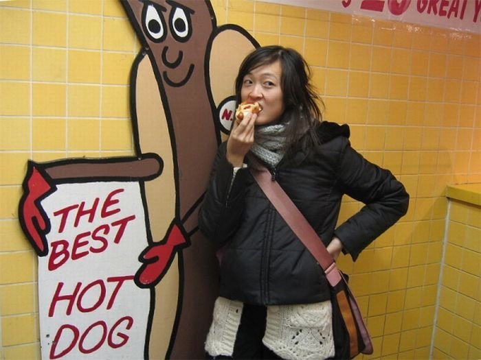 girl eating hot dog