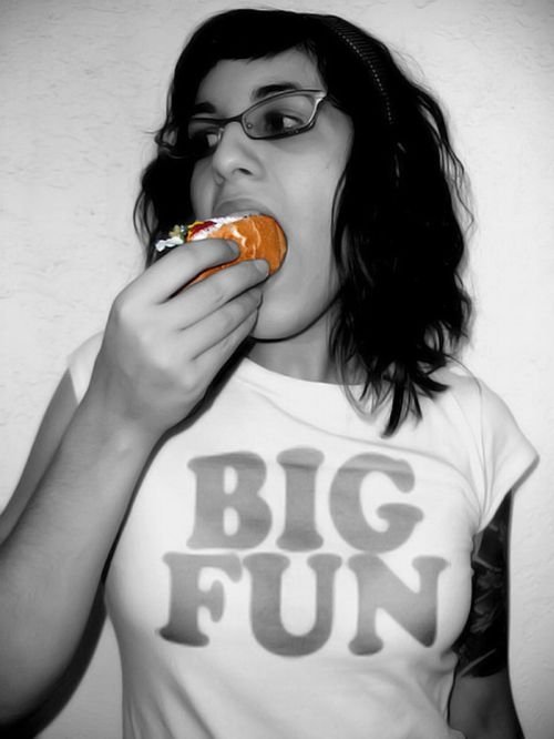 girl eating hot dog