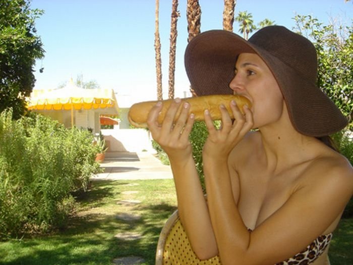 girl eating hot dog