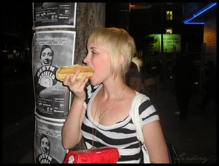 girl eating hot dog