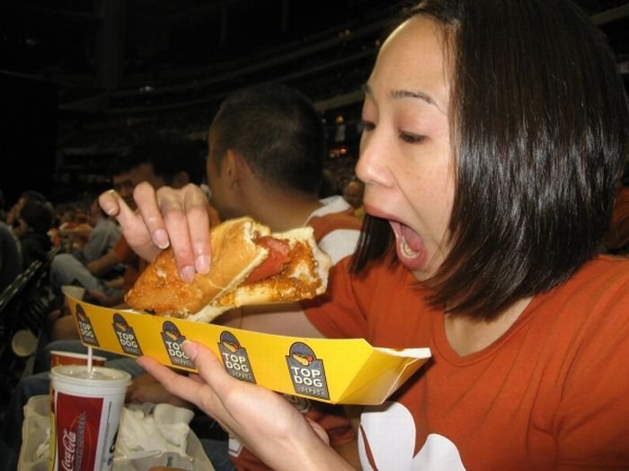 girl eating hot dog