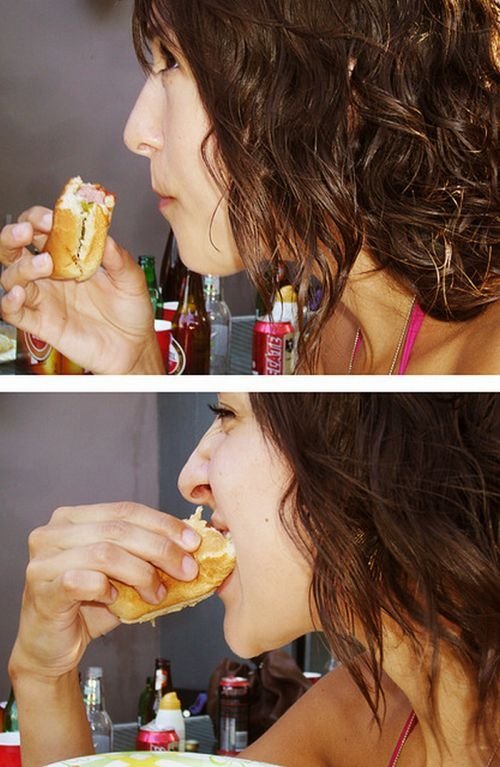 girl eating hot dog