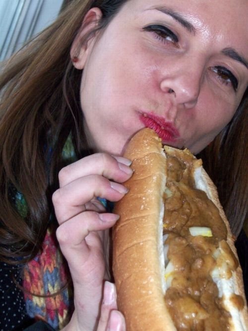 girl eating hot dog