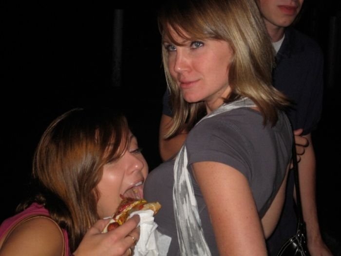 girl eating hot dog