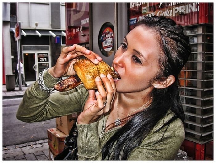 girl eating hot dog