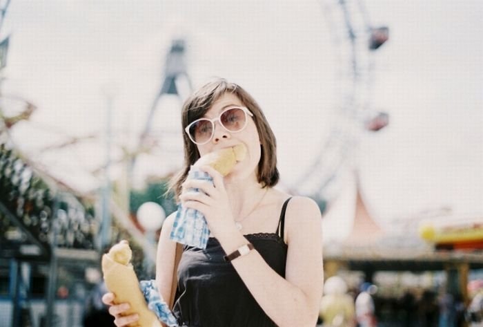 girl eating hot dog