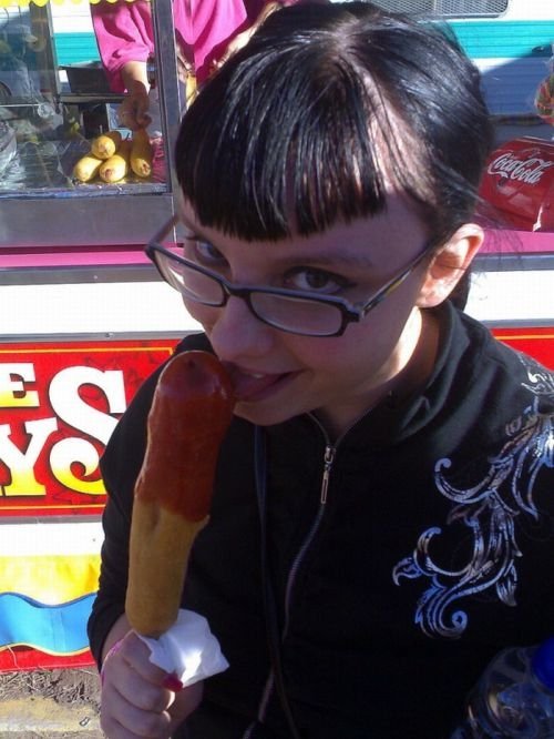 girl eating hot dog