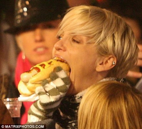 girl eating hot dog