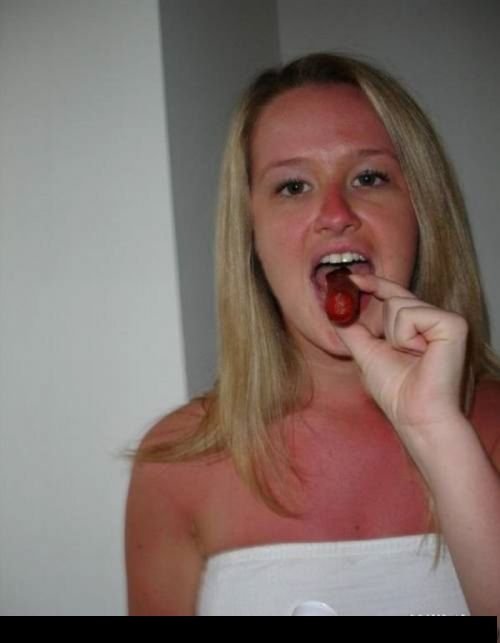 girl eating hot dog