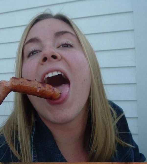 girl eating hot dog