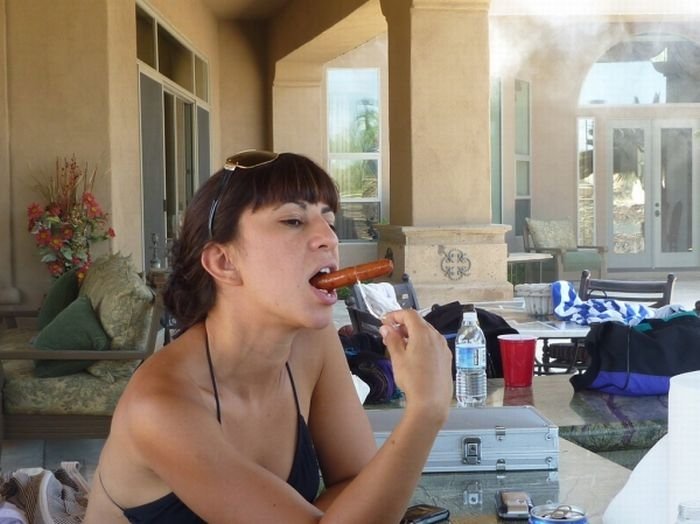 girl eating hot dog
