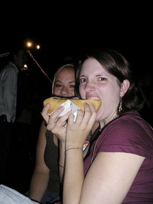 girl eating hot dog