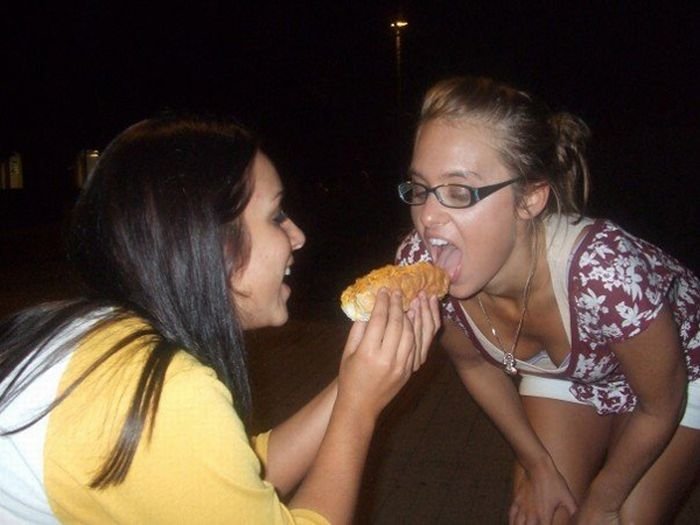 girl eating hot dog