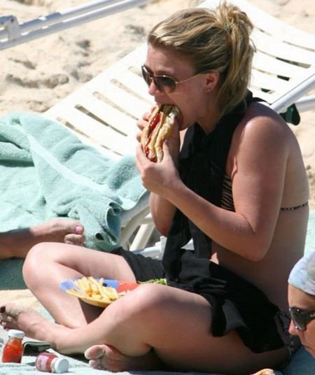 girl eating hot dog