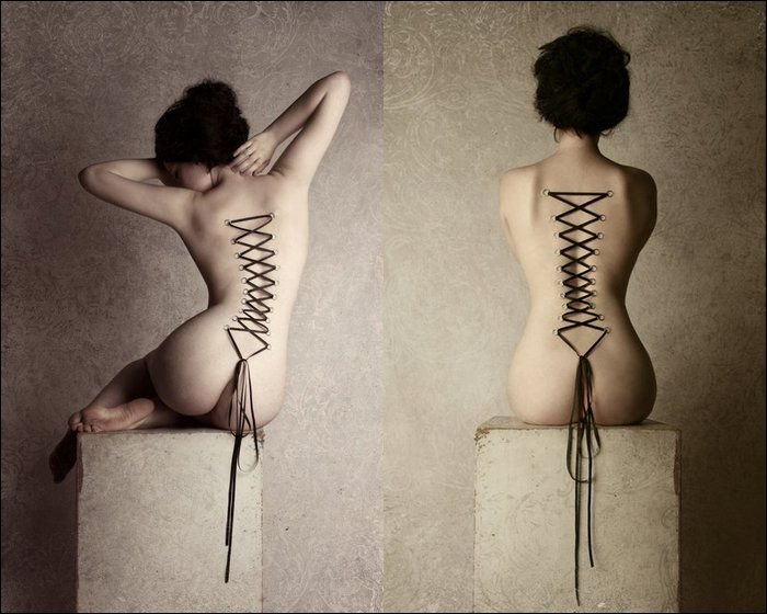 girl with a corset piercing and extreme body modifications