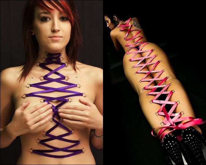 girl with a corset piercing and extreme body modifications