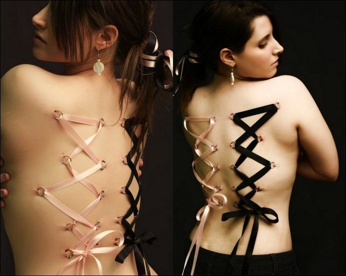 girl with a corset piercing and extreme body modifications