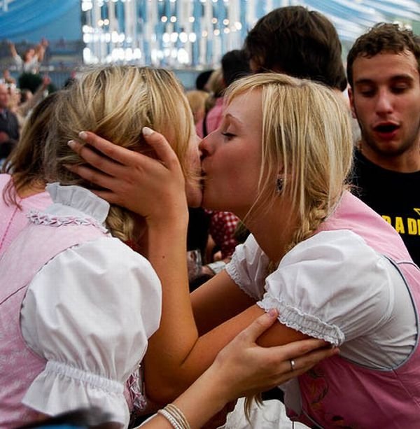 Oktoberfest girls kissing, Munich, Bavaria, Germany