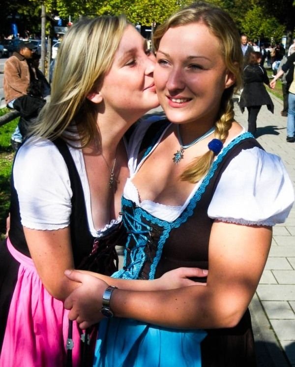 Oktoberfest girls kissing, Munich, Bavaria, Germany