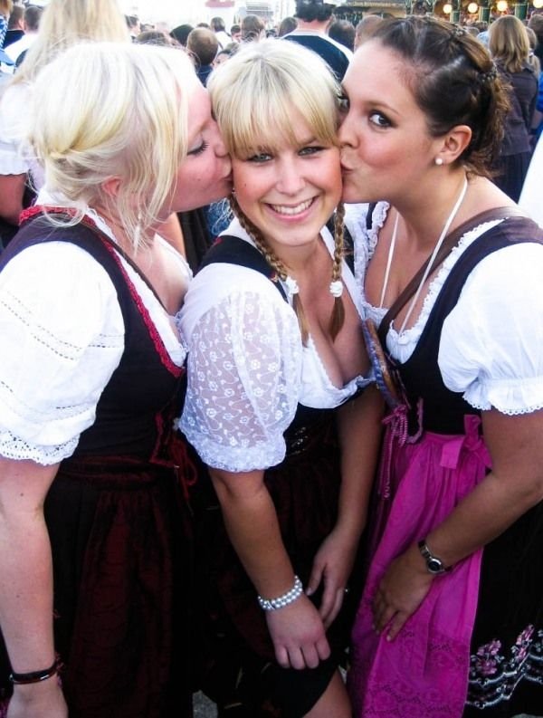 Oktoberfest girls kissing, Munich, Bavaria, Germany