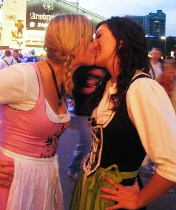 Oktoberfest girls kissing, Munich, Bavaria, Germany