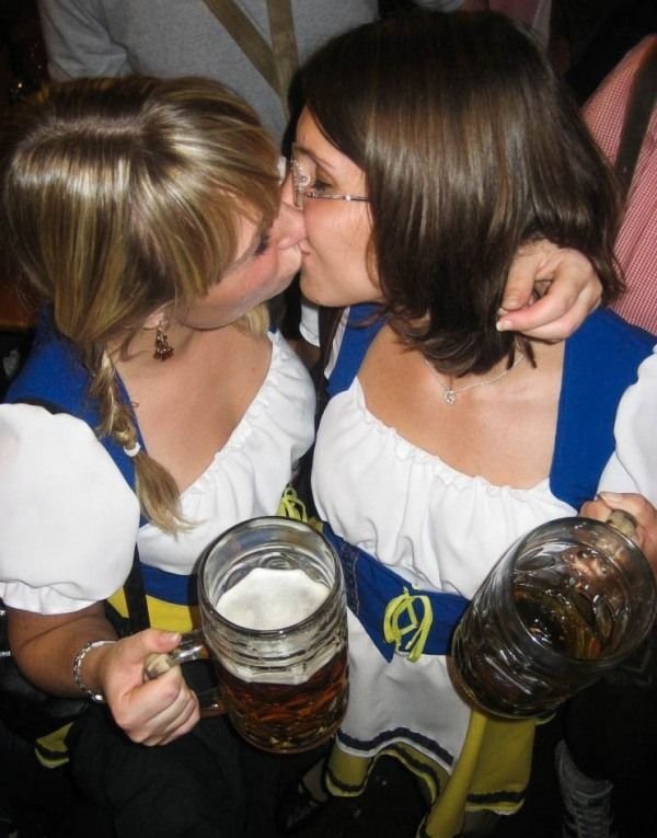 Oktoberfest girls kissing, Munich, Bavaria, Germany