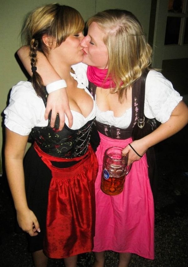 Oktoberfest girls kissing, Munich, Bavaria, Germany