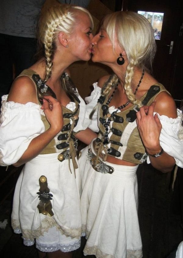 Oktoberfest girls kissing, Munich, Bavaria, Germany