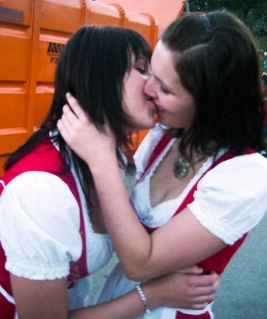 Oktoberfest girls kissing, Munich, Bavaria, Germany