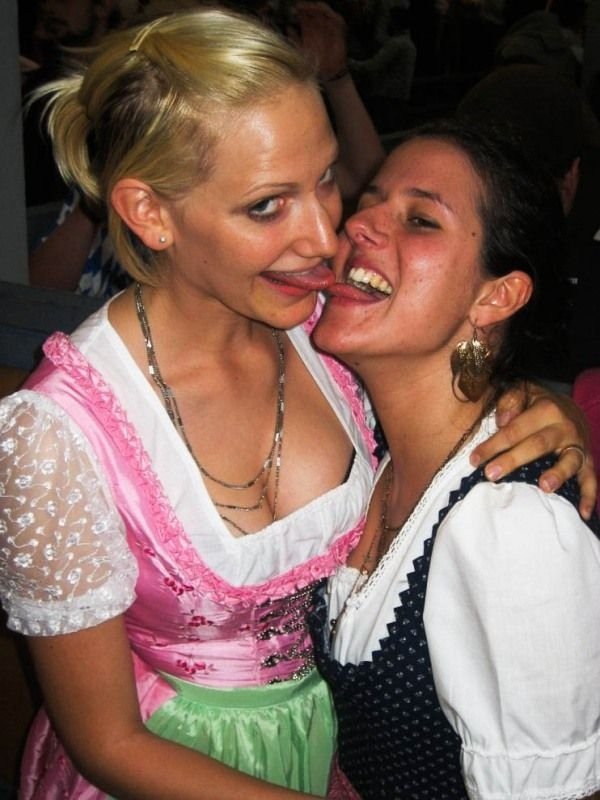 Oktoberfest girls kissing, Munich, Bavaria, Germany