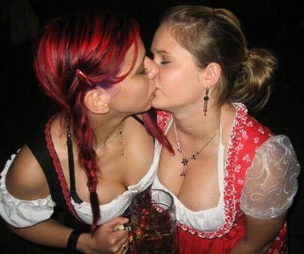 Oktoberfest girls kissing, Munich, Bavaria, Germany