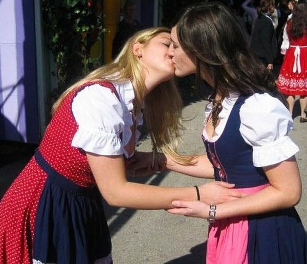 Oktoberfest girls kissing, Munich, Bavaria, Germany