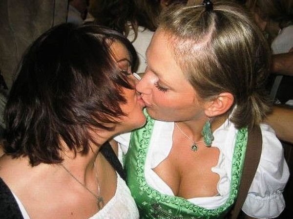 Oktoberfest girls kissing, Munich, Bavaria, Germany