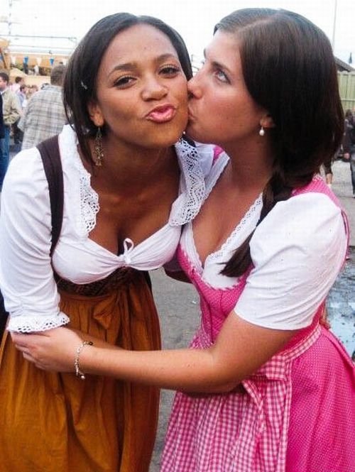 Oktoberfest girls kissing, Munich, Bavaria, Germany