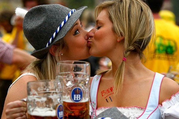 Oktoberfest girls kissing, Munich, Bavaria, Germany