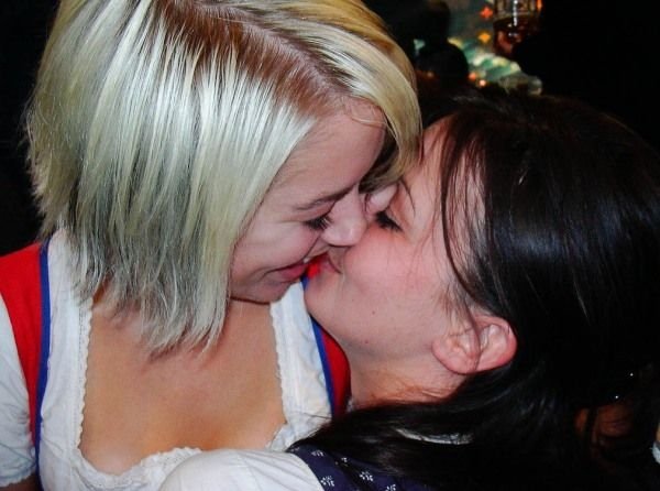 Oktoberfest girls kissing, Munich, Bavaria, Germany